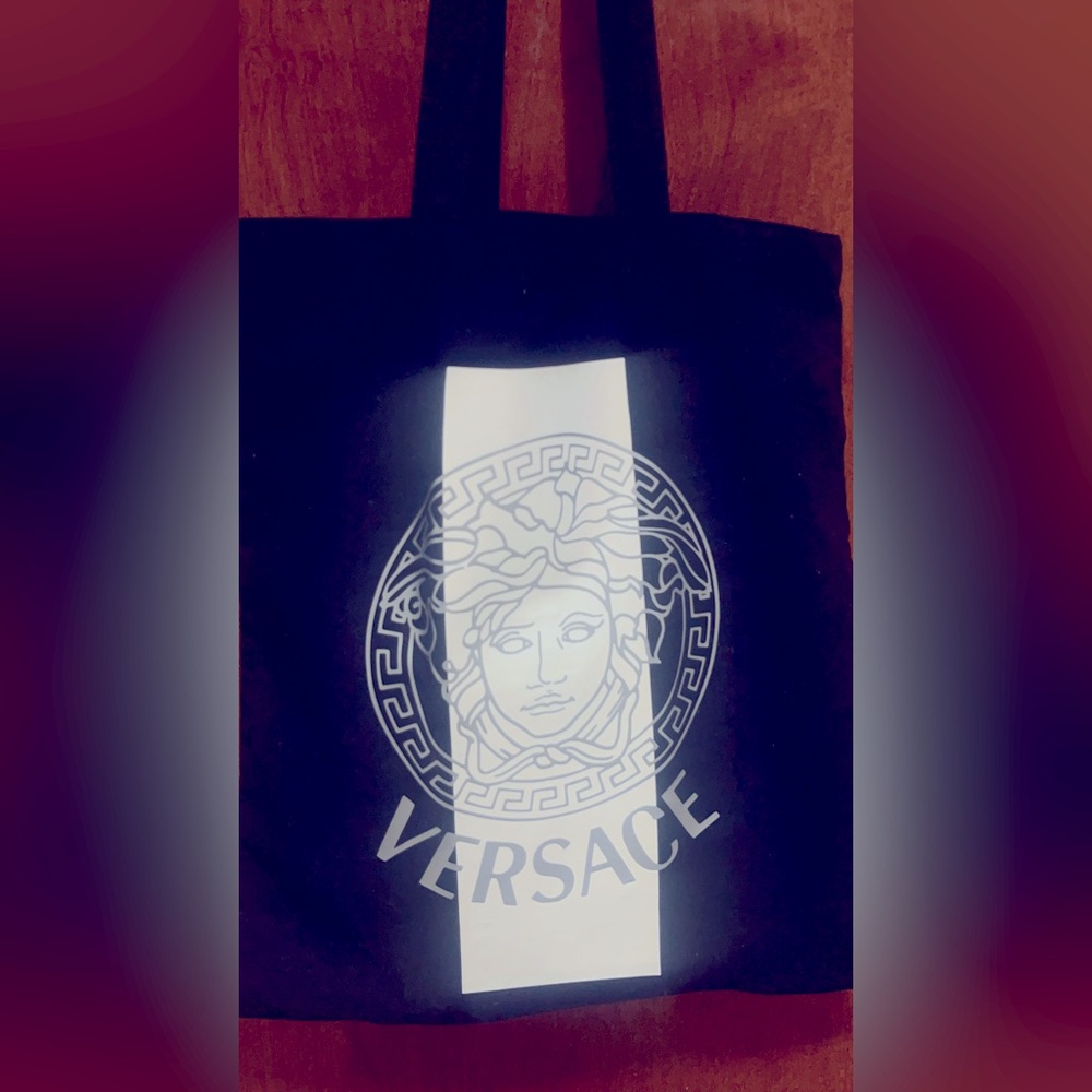 Don’t Tell A Vera Saki. Black canvas tote with a Medusa like logo thrift find